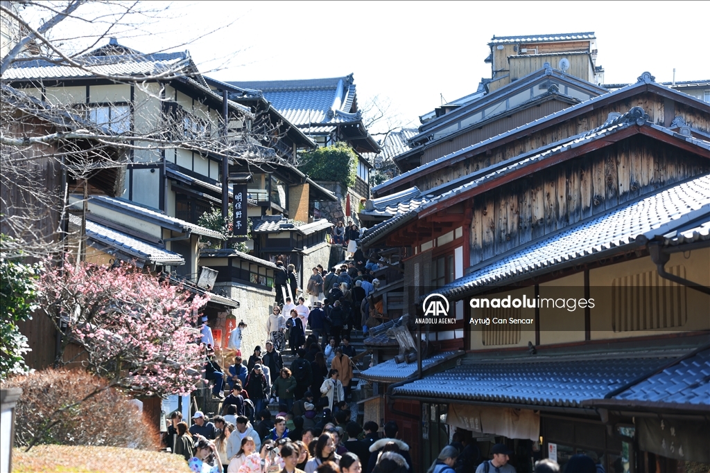 Fushimi Inari Shrine in Kyoto welcomes tourists and locals, reflecting daily life