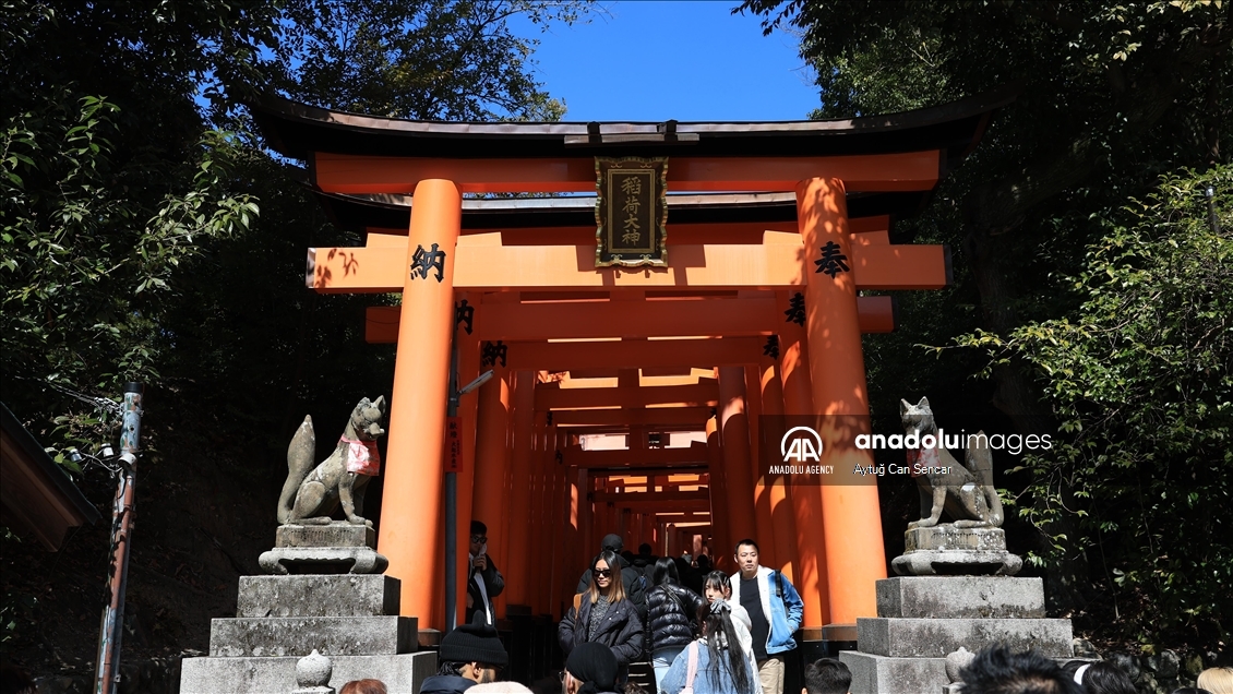 Fushimi Inari Shrine in Kyoto welcomes tourists and locals, reflecting daily life