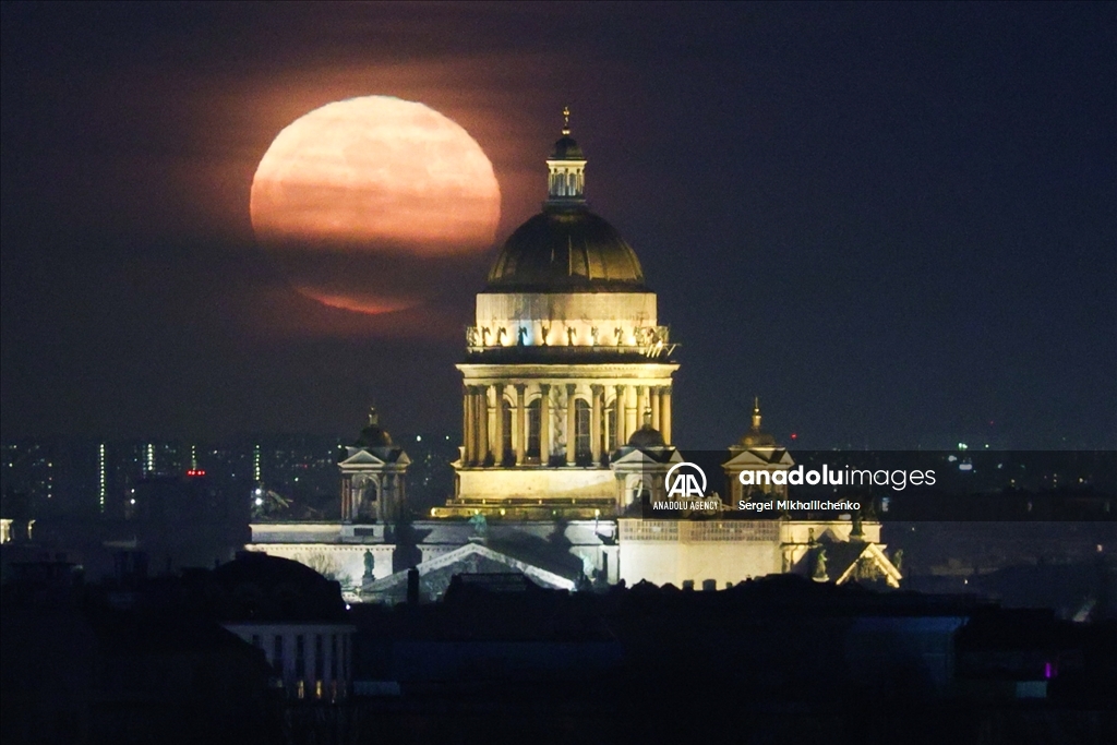 Full moon rises over Saint-Petersburg