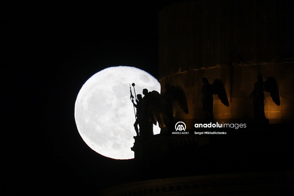 Full moon rises over Saint-Petersburg