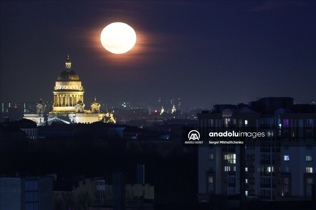 Full moon rises over Saint-Petersburg