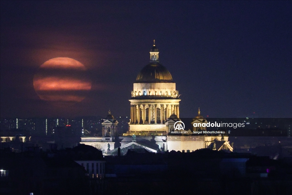 Full moon rises over Saint-Petersburg