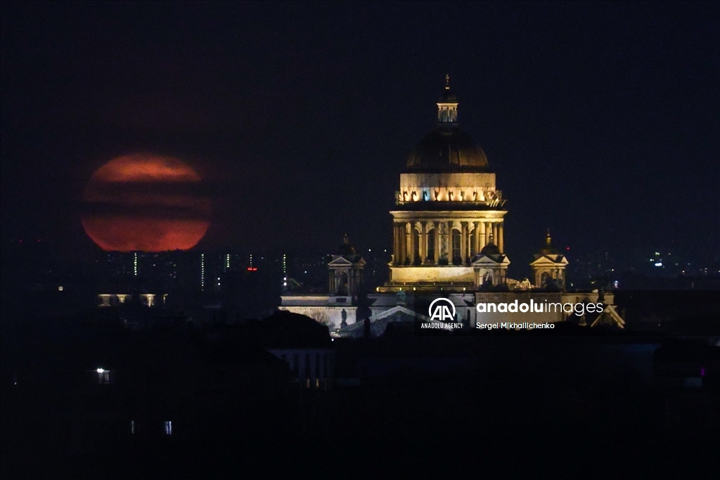 Full moon rises over Saint-Petersburg