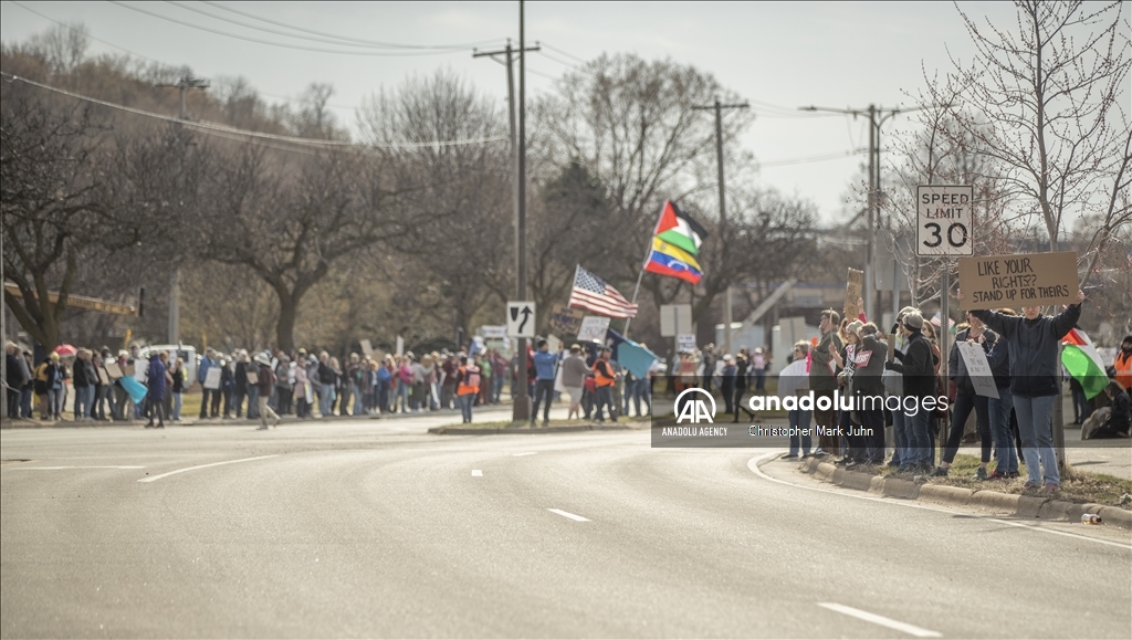 Demonstrators gather outside the El Salvador Consulate to protest the government arrests in Minnesota