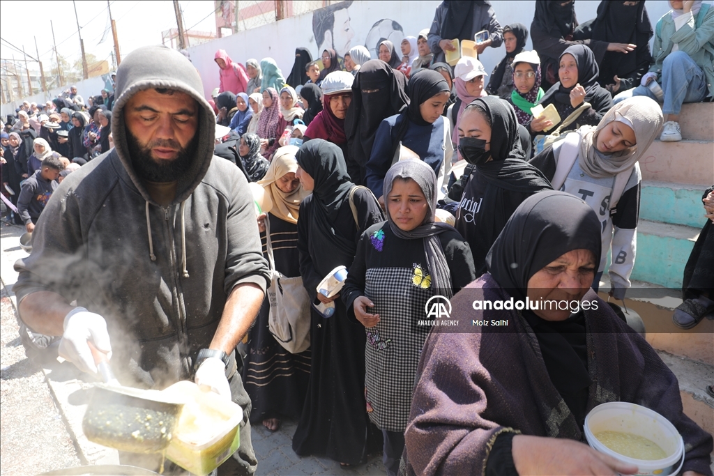 Food is distributed to Palestinians in Gaza under Israeli attacks