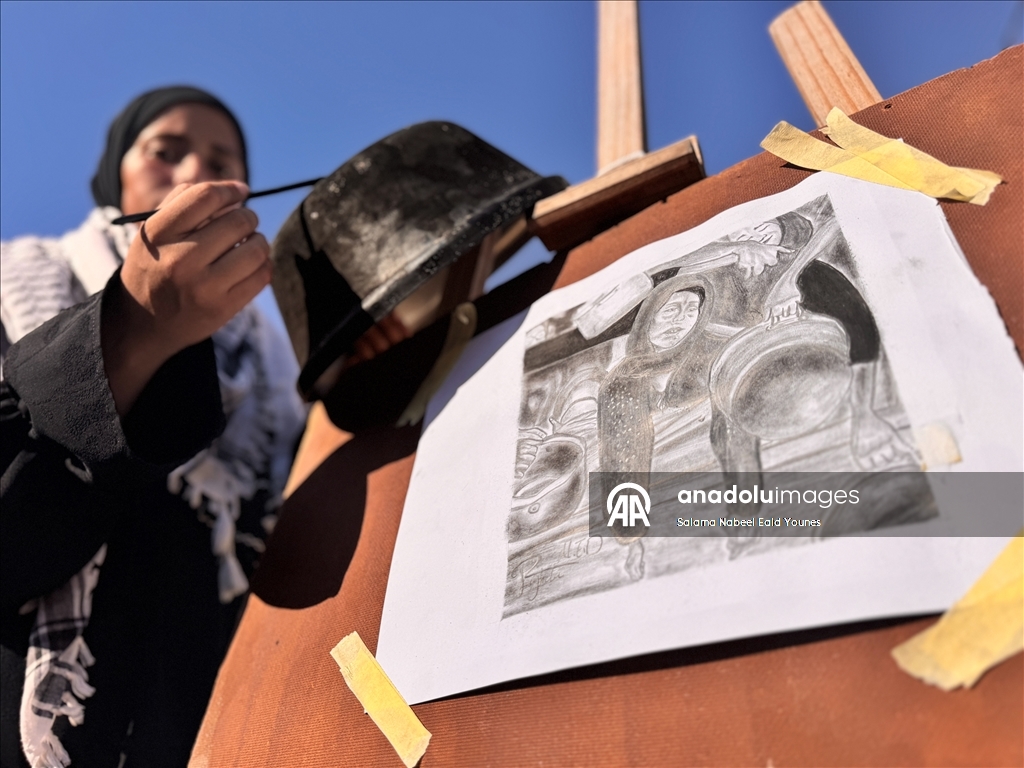 Gazzeli ressam, tencere isiyle halkının yaşadığı acıları yansıtıyor
