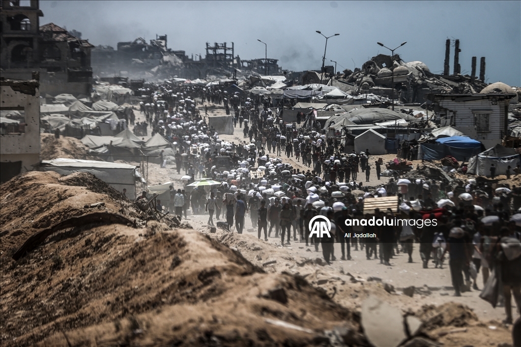 Palestinians receive limited amount of flour and infant formula at distribution point in Gaza
