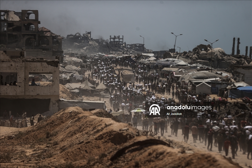 Palestinians receive limited amount of flour and infant formula at distribution point in Gaza