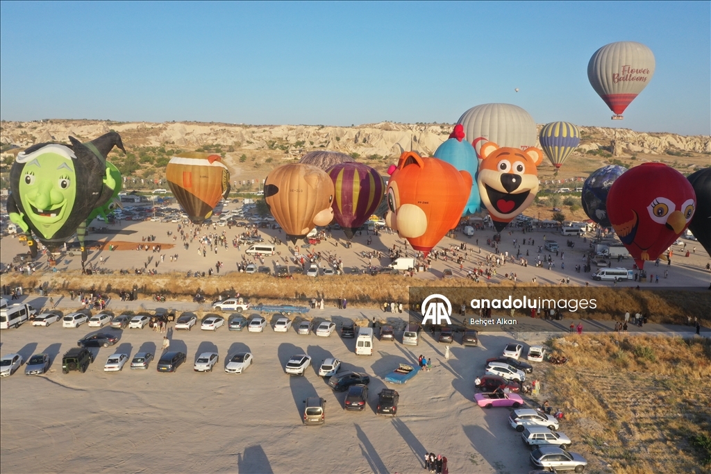 Hot air balloons with figures brighten up the skies of Cappadocia
