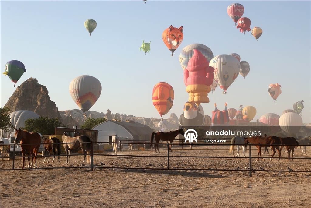 Hot air balloons with figures brighten up the skies of Cappadocia
