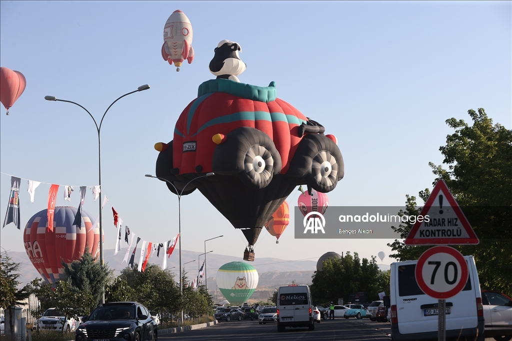 Hot air balloons with figures brighten up the skies of Cappadocia