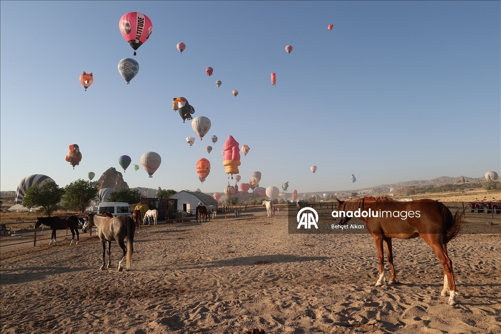 Hot air balloons with figures brighten up the skies of Cappadocia