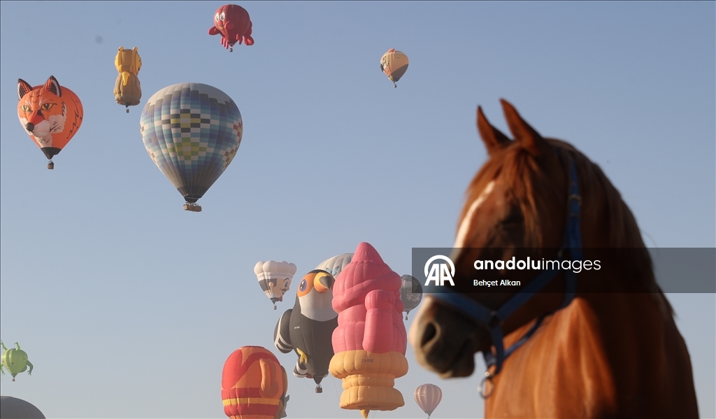 Hot air balloons with figures brighten up the skies of Cappadocia
