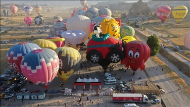 Hot air balloons with figures brighten up the skies of Cappadocia