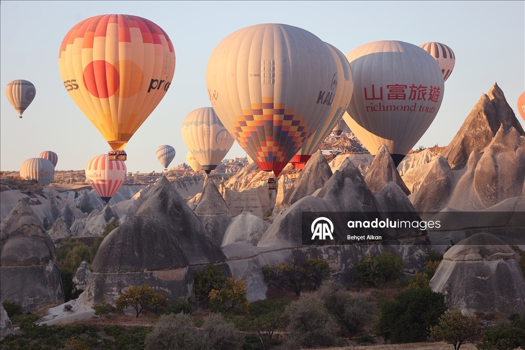 Hot air balloons add color to the valleys in Cappadocia