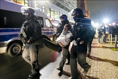 Police officers intervene in a pro-Palestinian demonstration near Alexanderplatz Square and detaining several protesters during the rally in Berlin, Germany
