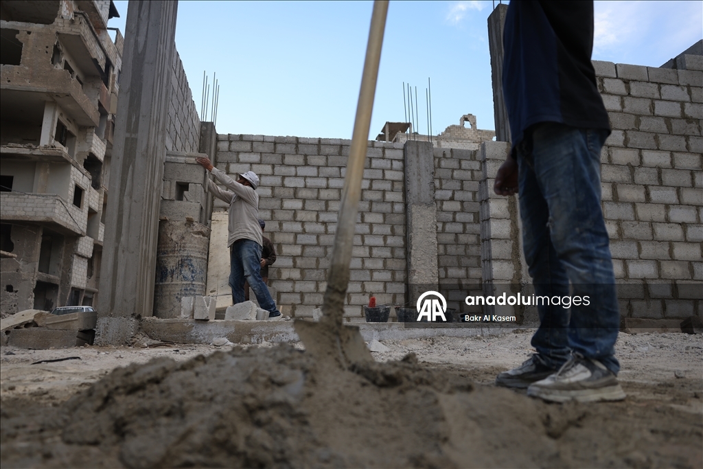 Syrians rebuild war-damaged homes in damascus with their own means