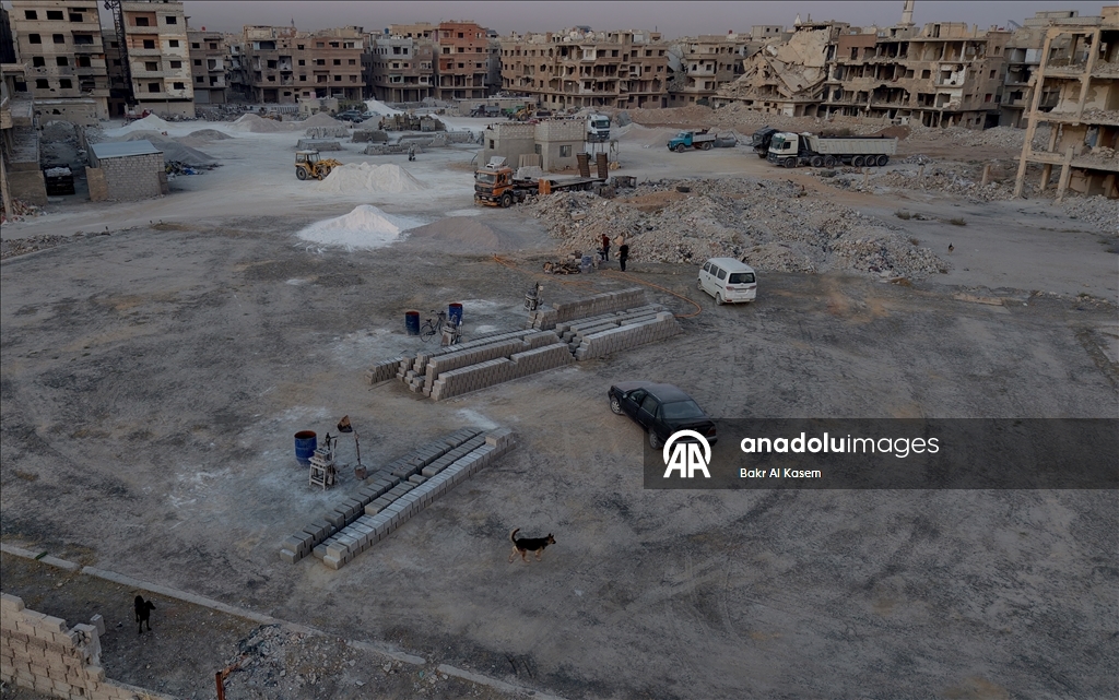 Syrians rebuild war-damaged homes in damascus with their own means