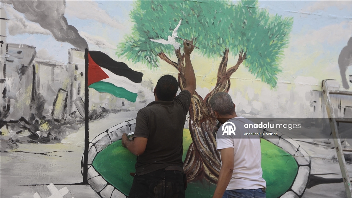 Filistinli ressamlar, Gazze'deki ekolojik kırıma dikkat çekmek için grafiti çizdi 