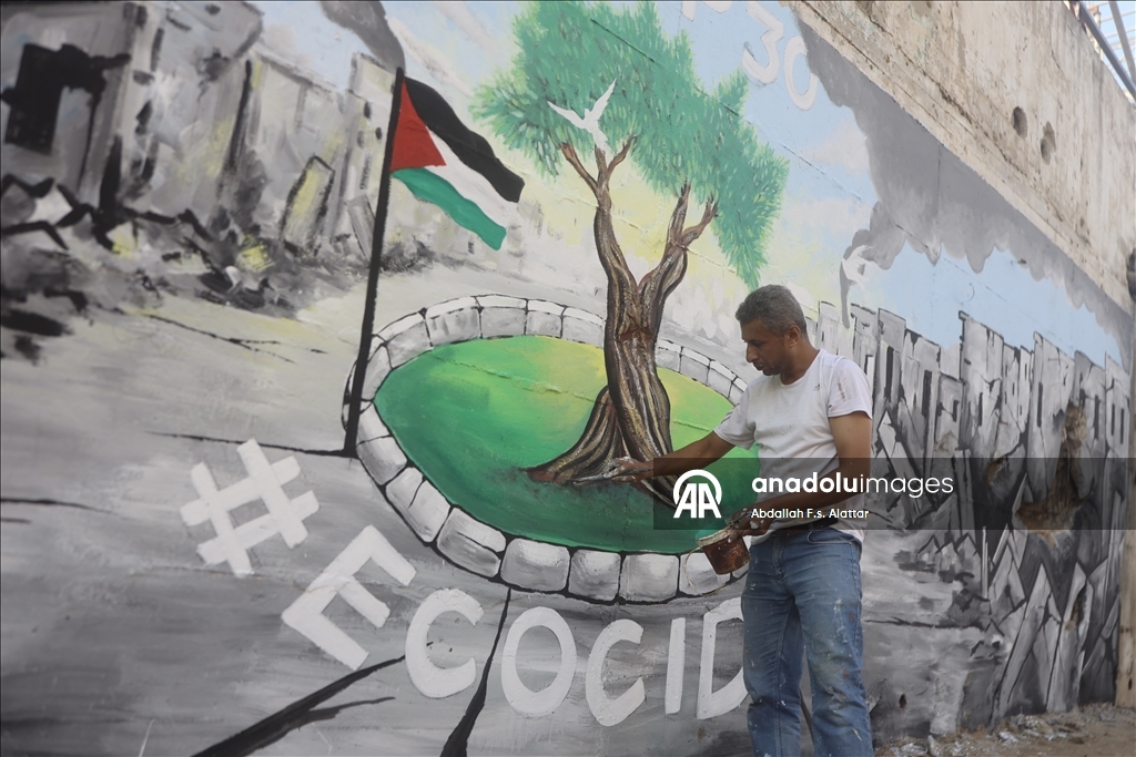 Палестинские художники нарисовали граффити, чтобы привлечь внимание к экологическому разрушению в Газе