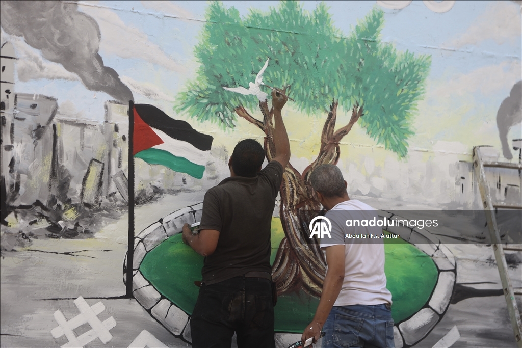 Палестинские художники нарисовали граффити, чтобы привлечь внимание к экологическому разрушению в Газе