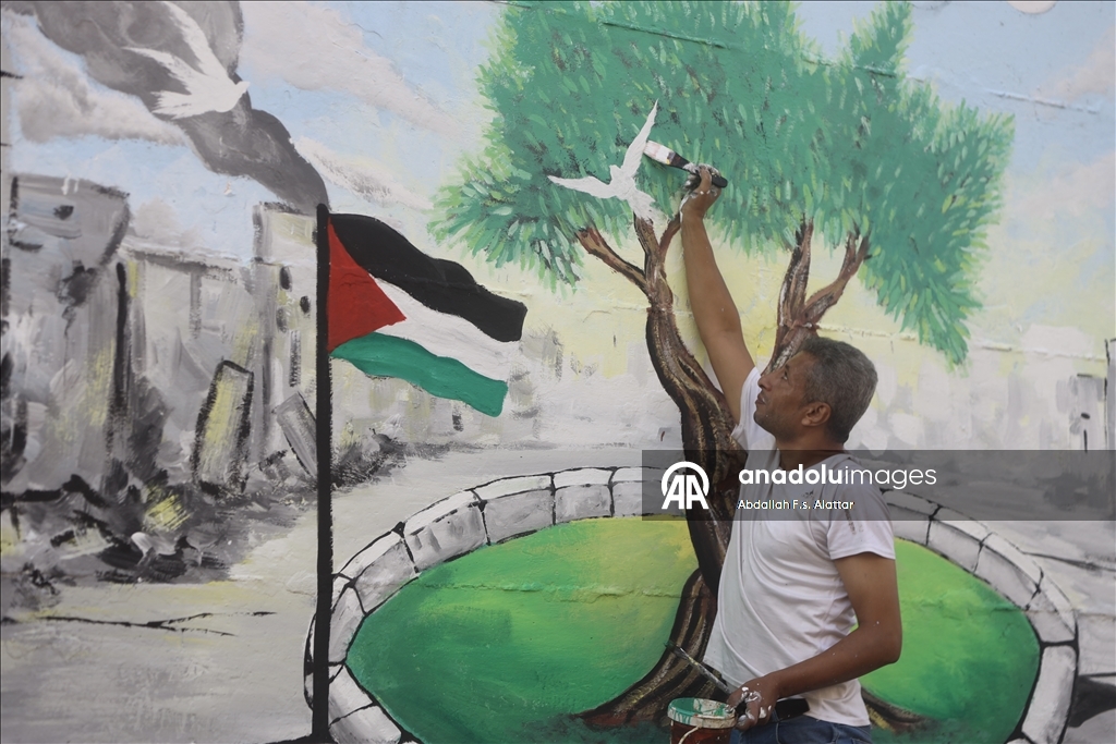 Палестинские художники нарисовали граффити, чтобы привлечь внимание к экологическому разрушению в Газе