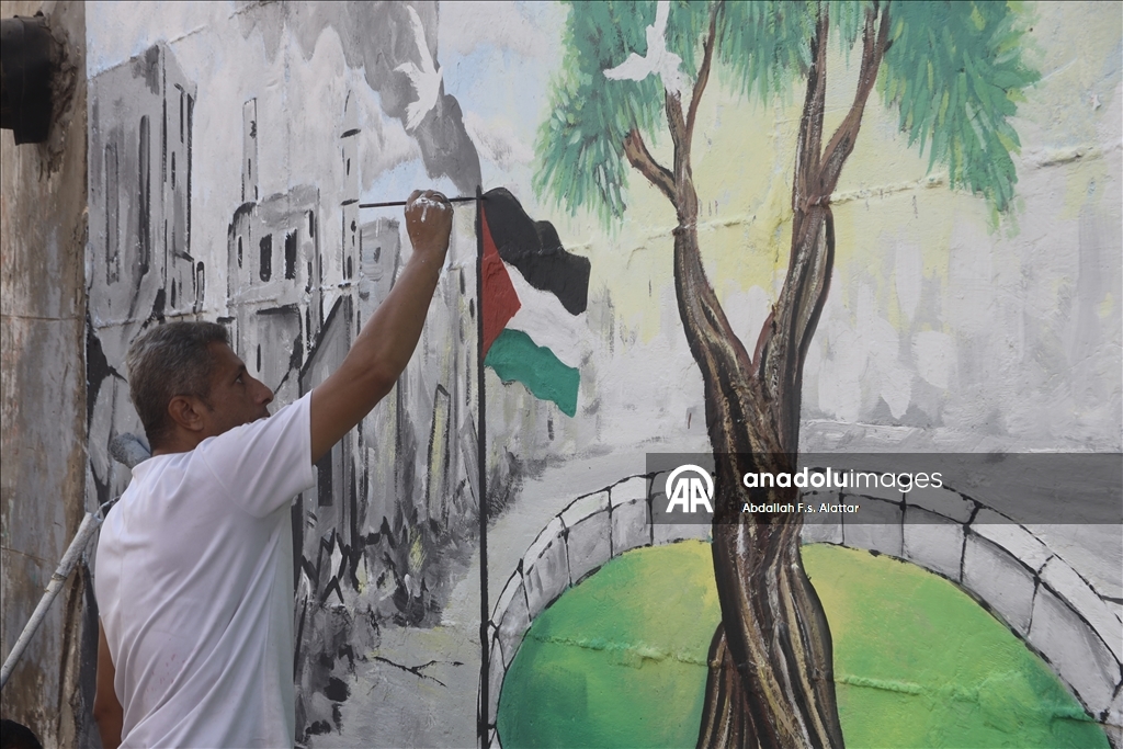 Палестинские художники нарисовали граффити, чтобы привлечь внимание к экологическому разрушению в Газе