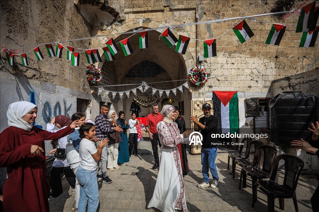 Palestinian student Iman Lulu celebrates exam success amid war-torn Gaza ​​​​​​​ 