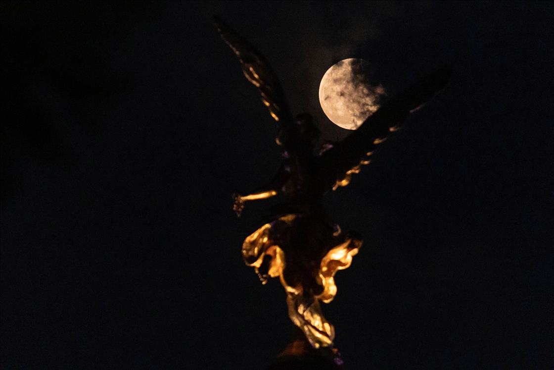 The full moon rose over cities across the world