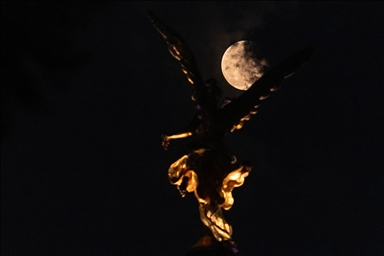 The full moon rose over cities across the world