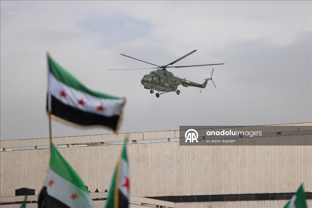 عروض عسكرية في سوريا احتفالا بالذكرى الأولى لإسقاط الأسد