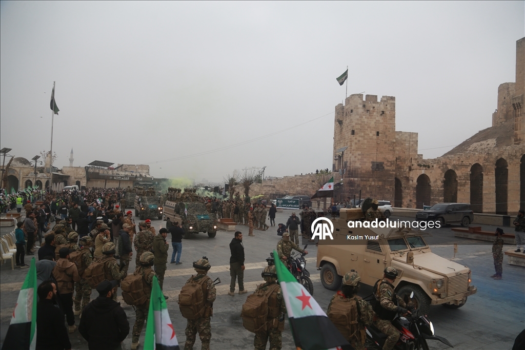 عروض عسكرية في سوريا احتفالا بالذكرى الأولى لإسقاط الأسد