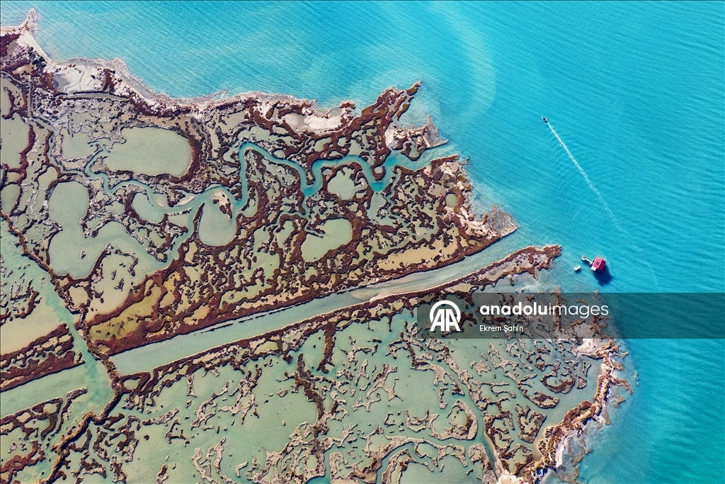 Natural formations on the water surface stand out at Yumurtalik Lagoon in Turkiye’s Adana