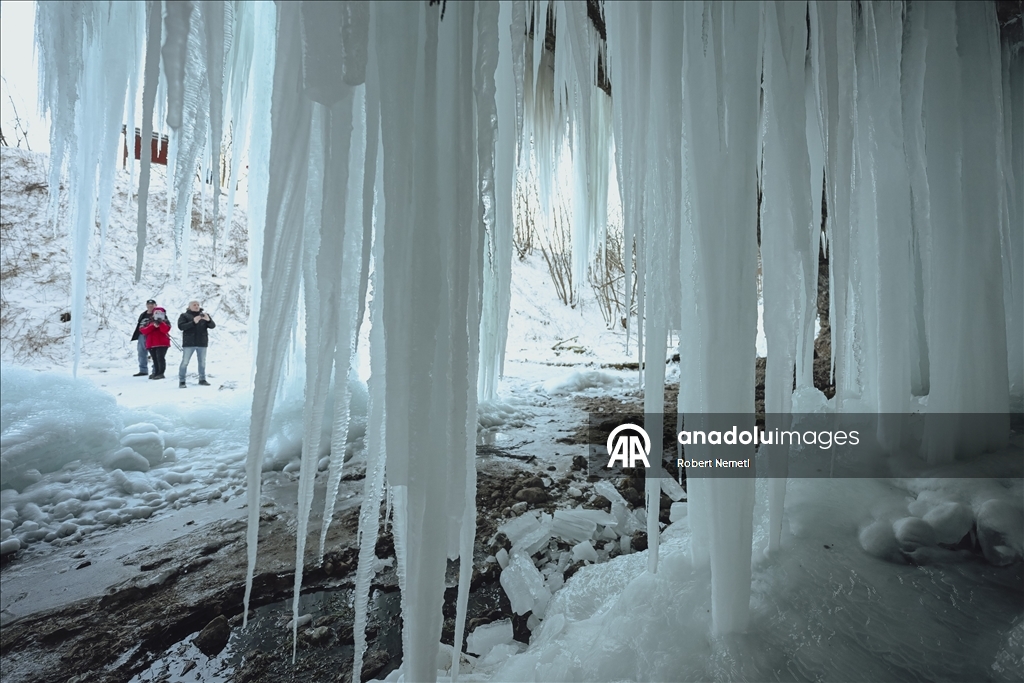 Spectacular ice fall Siklava Skala attracts hundreds during cold winter days in Slovakia