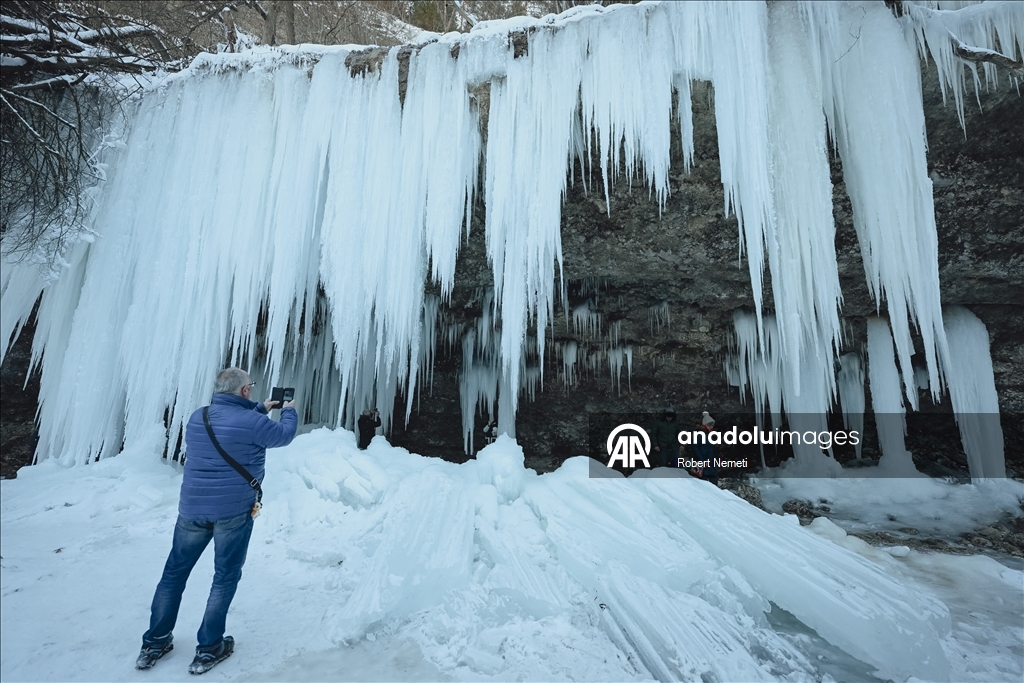 Spectacular ice fall Siklava Skala attracts hundreds during cold winter days in Slovakia