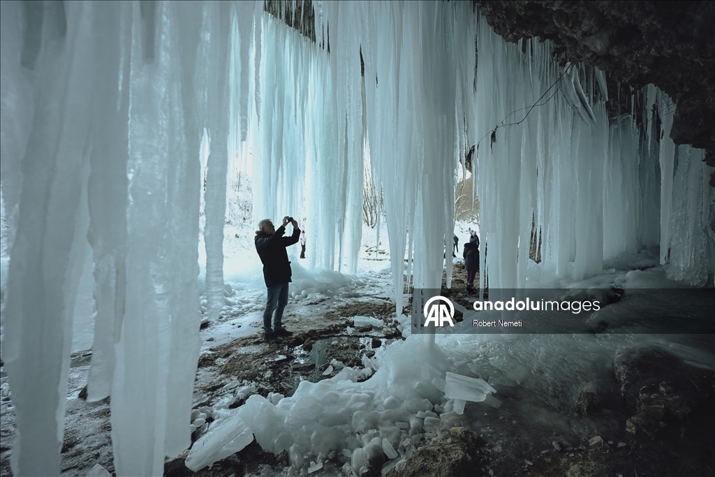 Spectacular ice fall Siklava Skala attracts hundreds during cold winter days in Slovakia