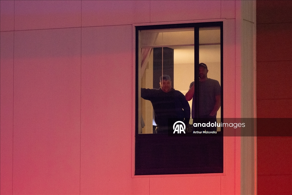 Protesters hold demonstration in front of a hotel believed to be housing federal immigration agents in Minneapolis