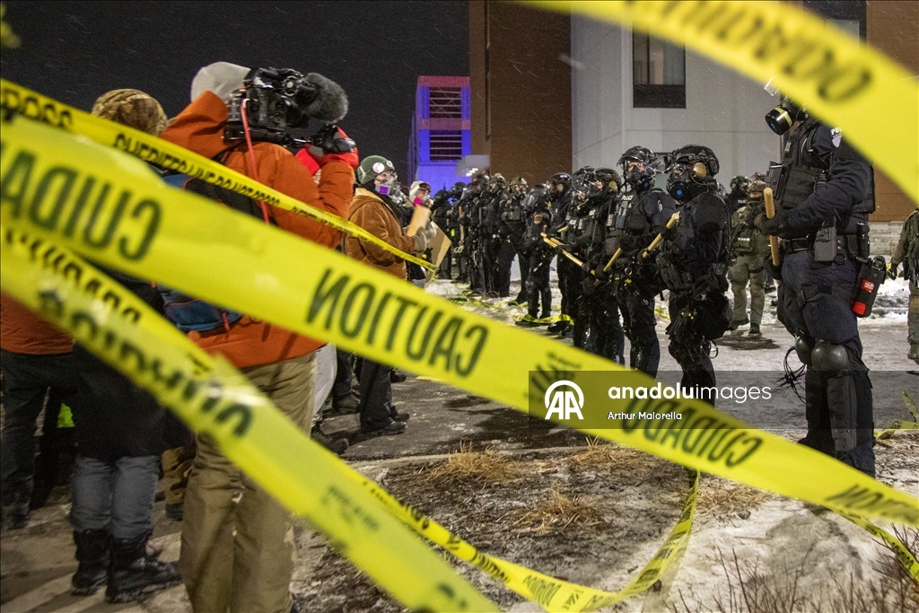 Protesters hold demonstration in front of a hotel believed to be housing federal immigration agents in Minneapolis