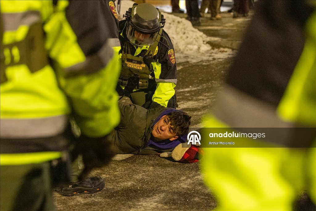 Protesters hold demonstration in front of a hotel believed to be housing federal immigration agents in Minneapolis
