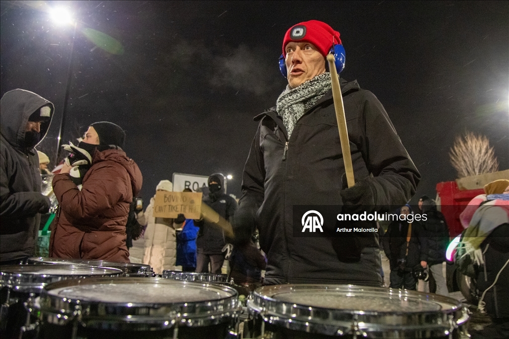 Protesters hold demonstration in front of a hotel believed to be housing federal immigration agents in Minneapolis