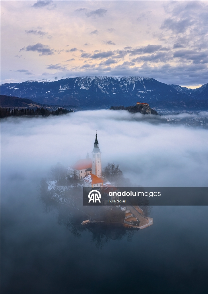 Slovenia's Lake Bled offers stunning views as fog blankets historic island