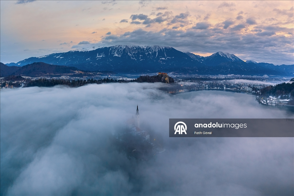Slovenia's Lake Bled offers stunning views as fog blankets historic island