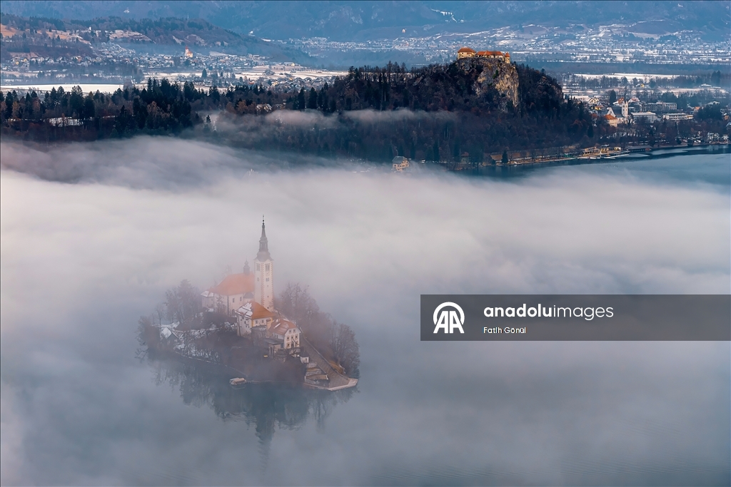 Slovenia's Lake Bled offers stunning views as fog blankets historic island