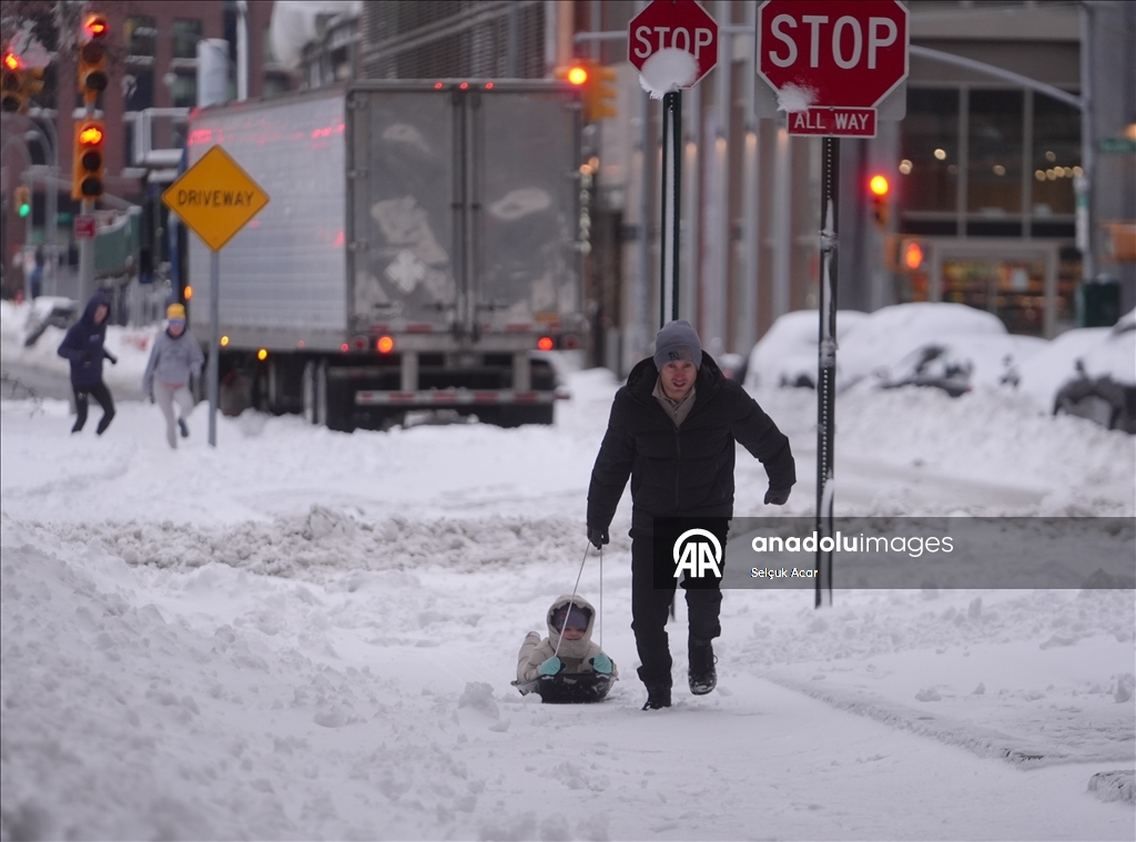 People in New York City enjoy the snow after a major snowstorm hits the city