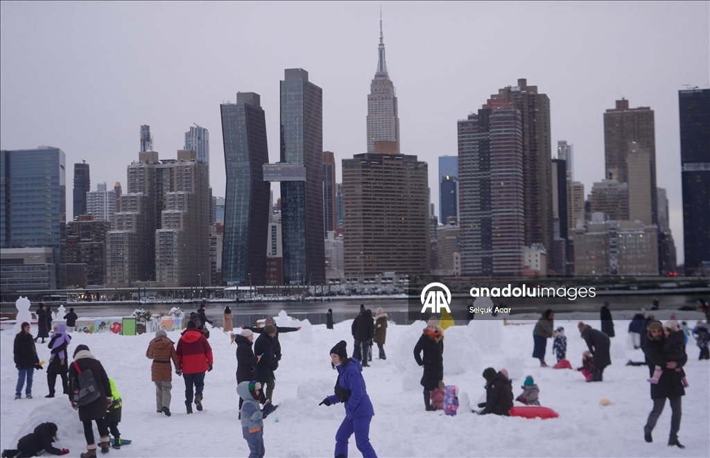 People in New York City enjoy the snow after a major snowstorm hits the city