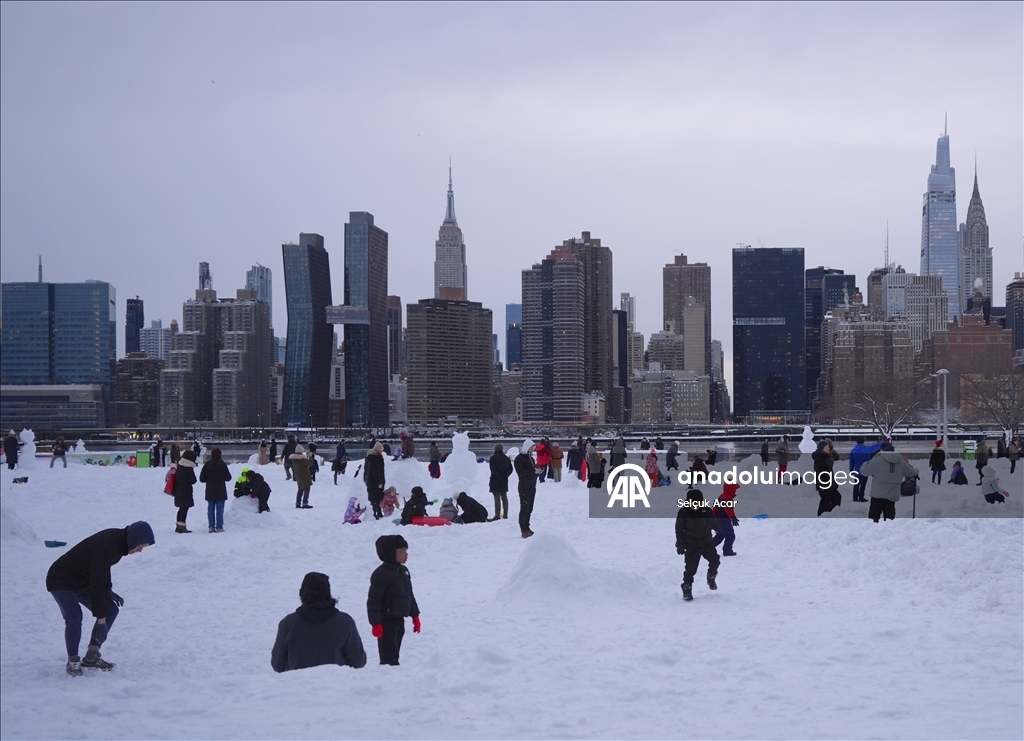People in New York City enjoy the snow after a major snowstorm hits the city