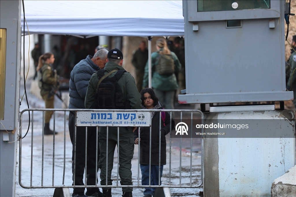 Palestinians cross from Bethlehem to Jerusalem for the second Friday prayer of Ramadan