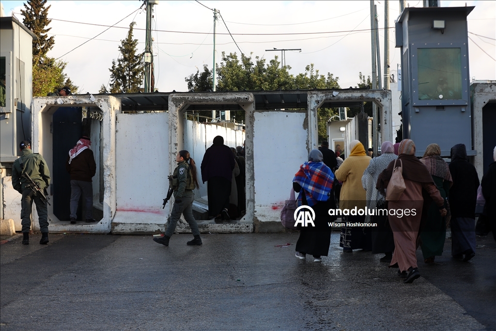 Palestinians cross from Bethlehem to Jerusalem for the second Friday prayer of Ramadan