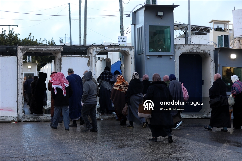 Palestinians cross from Bethlehem to Jerusalem for the second Friday prayer of Ramadan