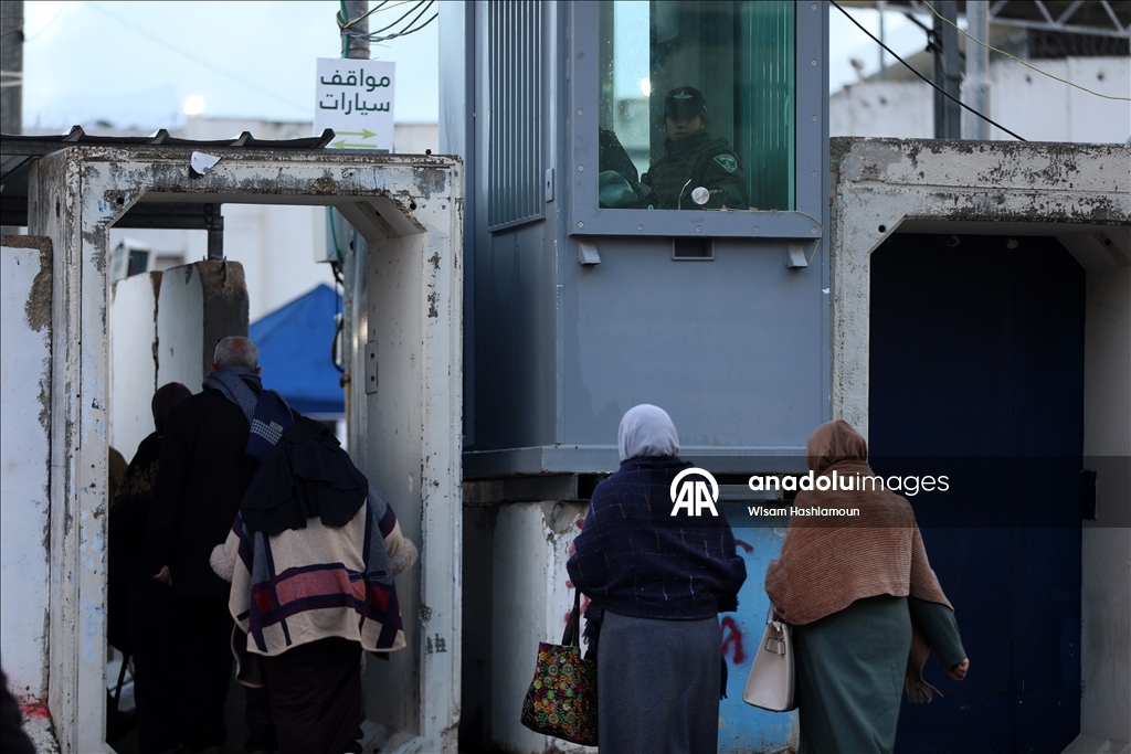 Palestinians cross from Bethlehem to Jerusalem for the second Friday prayer of Ramadan